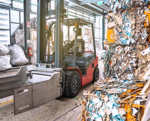 Used paper piles in industrial plants waiting to be recycled for reuse_